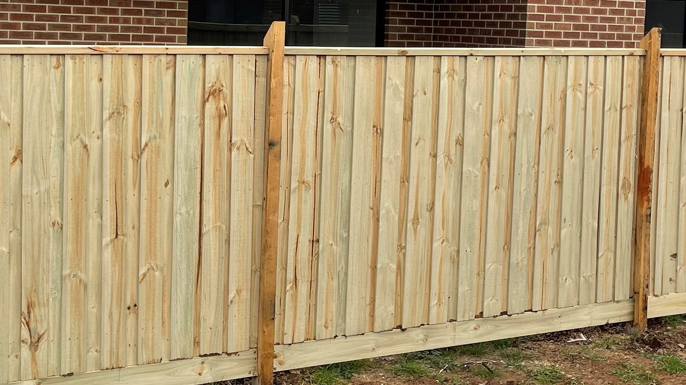 Timber Fence Photo with Brown Posts